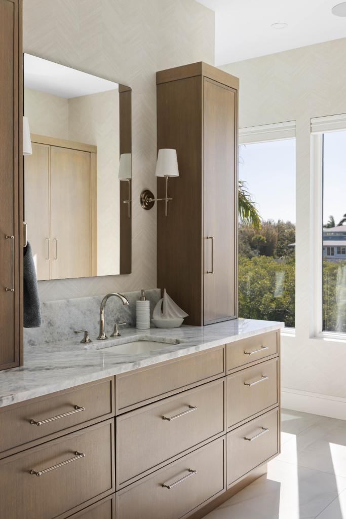 Luxury bathroom vanity with marble countertop and wood cabinetry